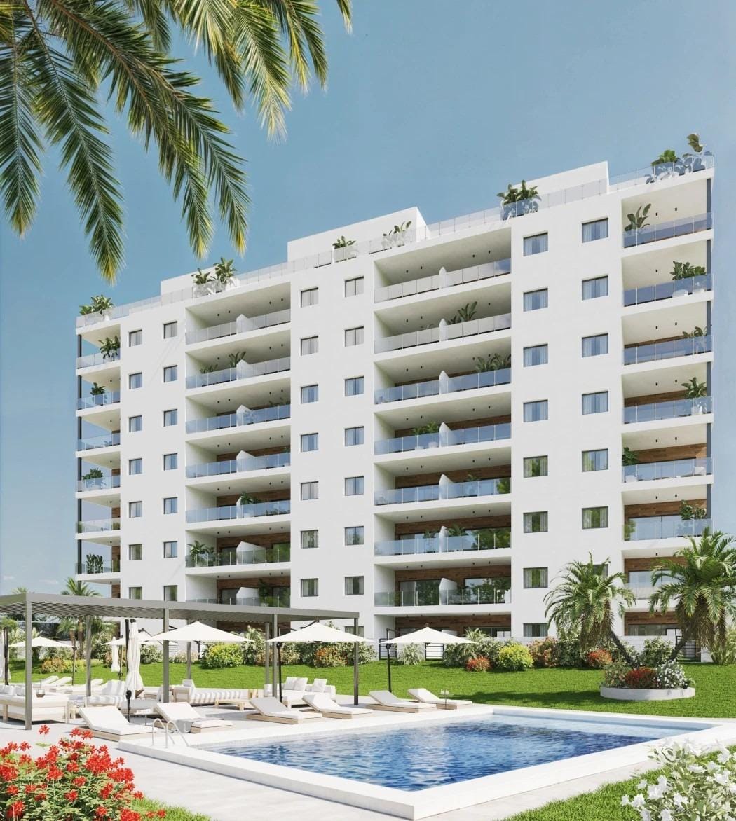 Contemporary apartment building with communal pool, sun terrace and landscaped gardens