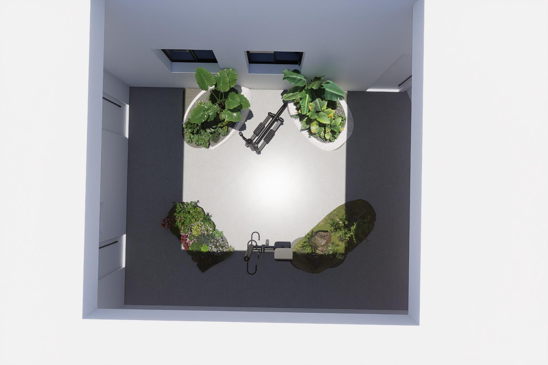 New-Build-Apartments-in-the-Centre-of-Torrevieja-Near-Playa-del-Cura-11 Top-down render of a small courtyard showing planted beds and a single piece of outdoor gym equipment