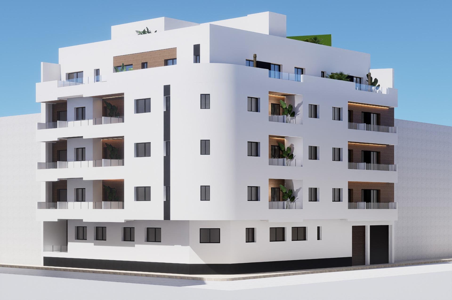 New Build Apartments in the Centre of Torrevieja Near Playa del Cura Corner elevation of a new build ground floor apartment block in Torrevieja with recessed balconies