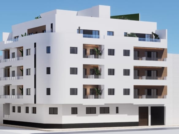 Exterior view of a white new-build apartment block with balconies in Torrevieja, Alicante