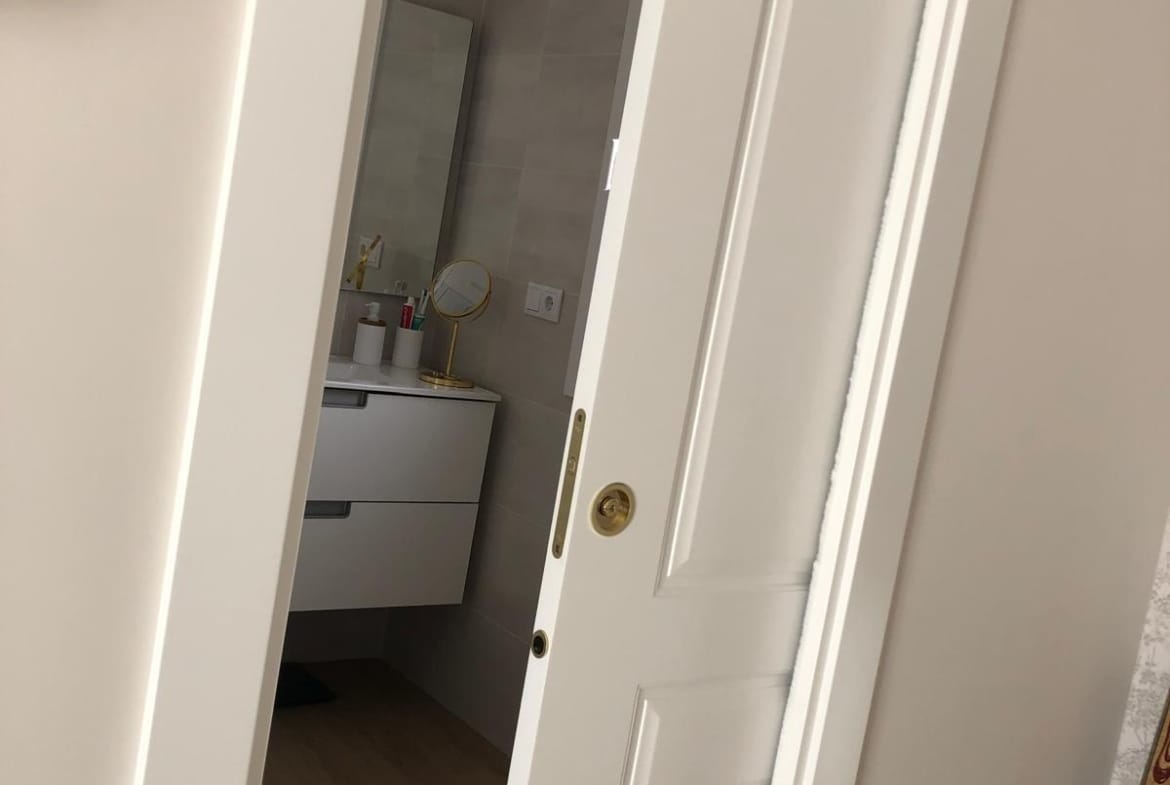 Bathroom doorway from a bedroom in a single-storey Aspe villa, Alicante