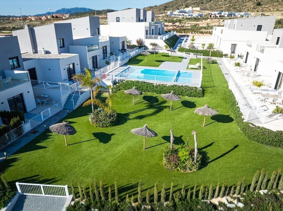 Aerial view of the communal pool, lawn and surrounding homes in Altaona Golf, Baños y Mendigo, Murcia
