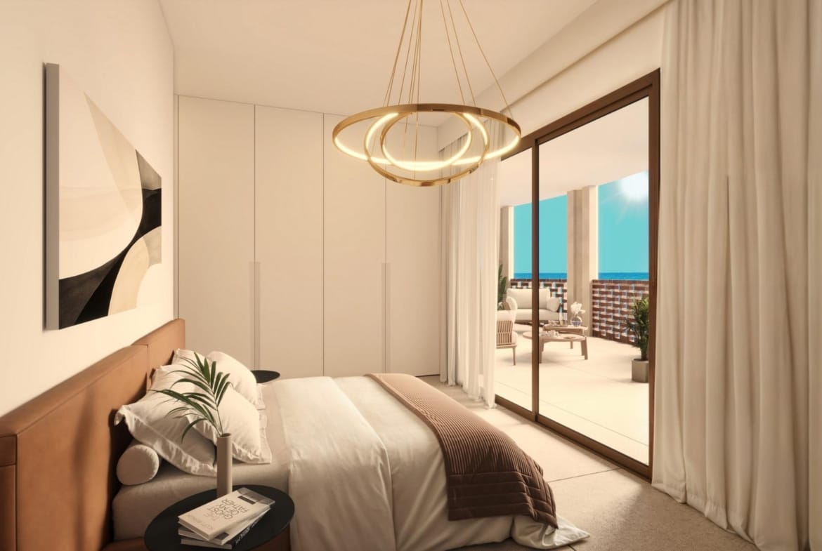 Bedroom with fitted wardrobes and direct access to the terrace