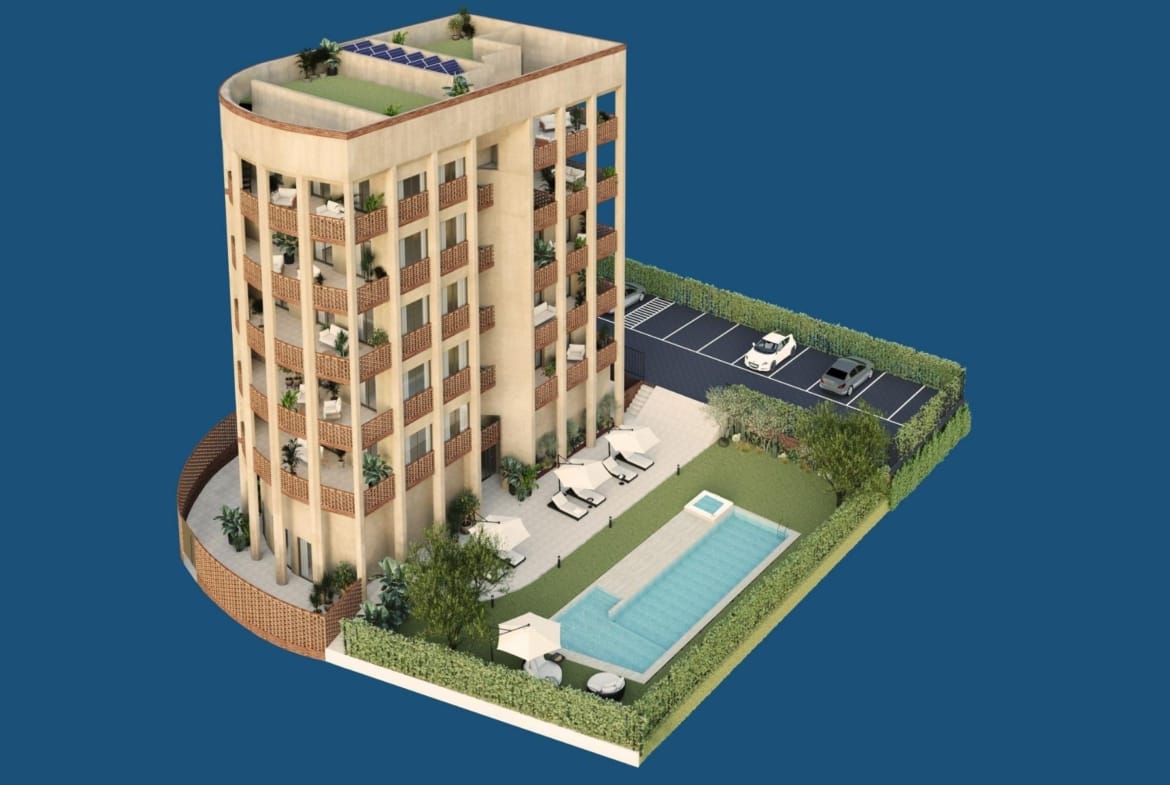 Aerial view of the building with pool, gardens and parking area