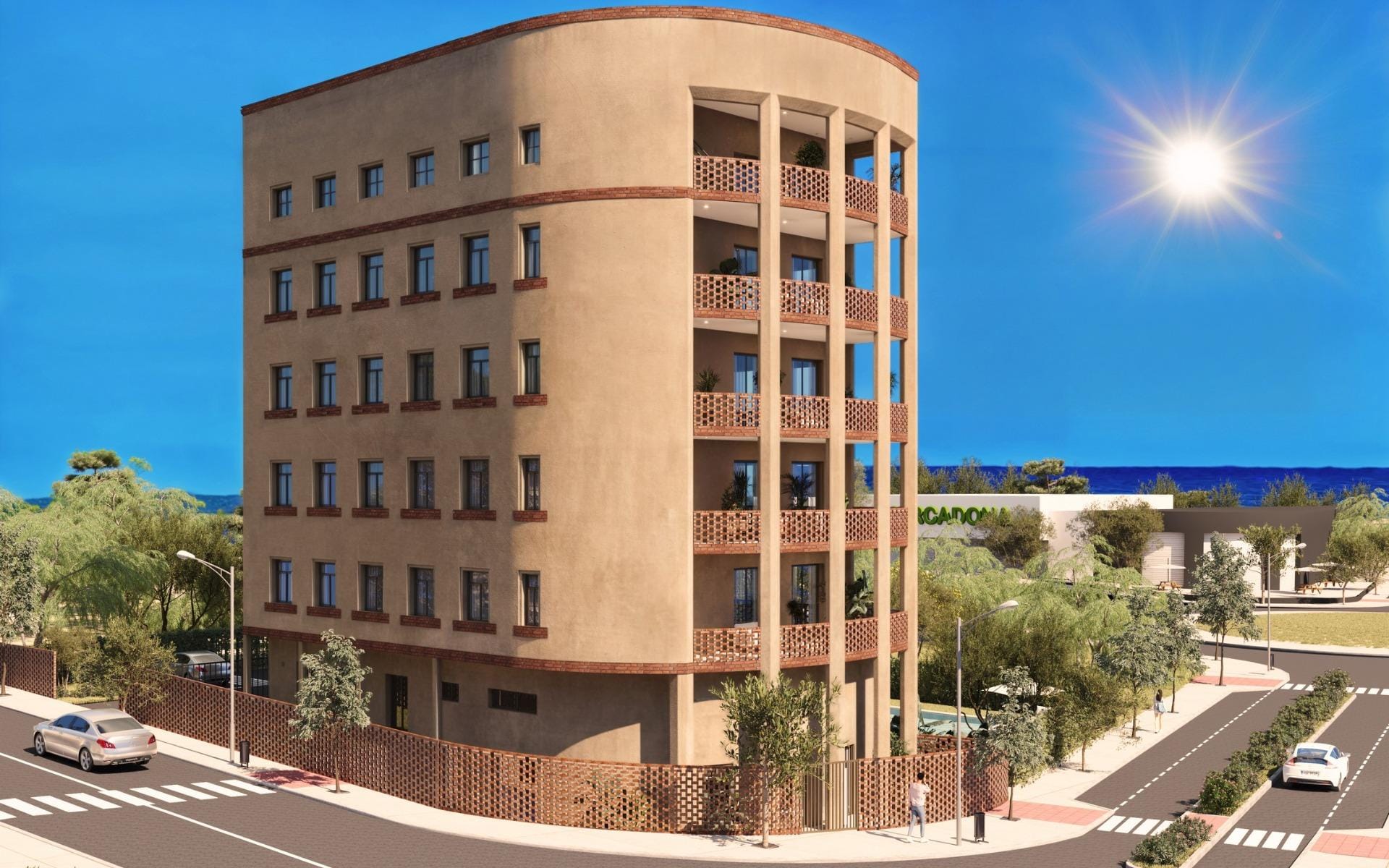 Street-facing exterior view of the apartment building with balconies near the coast
