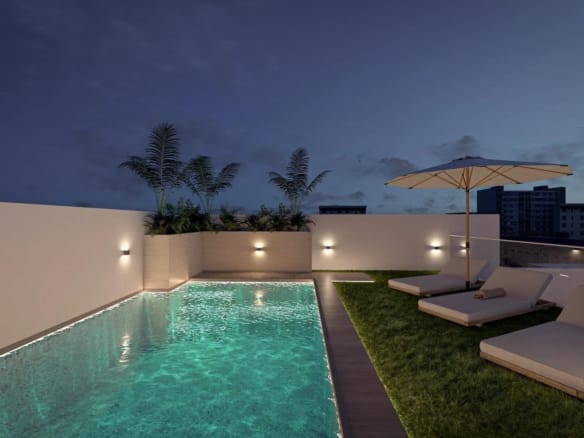 Rooftop swimming pool at dusk in Torrevieja, Alicante