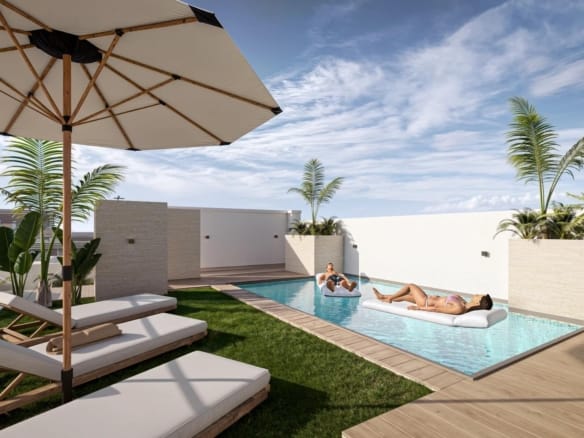 A communal rooftop pool with loungers and parasols in daylight in Torrevieja, Alicante