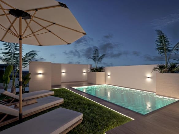 Rooftop swimming pool at dusk in Torrevieja, Alicante