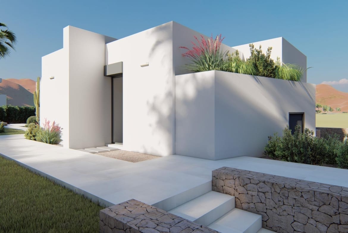 Contemporary villa entrance with clean white lines, planted terrace and stone retaining walls in La Manga Club, Murcia