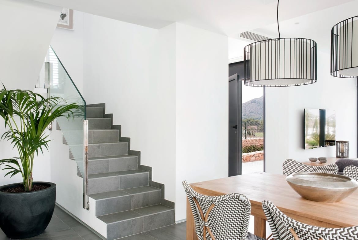 Dining area beside the staircase and large entrance glazing in La Manga Club, Murcia