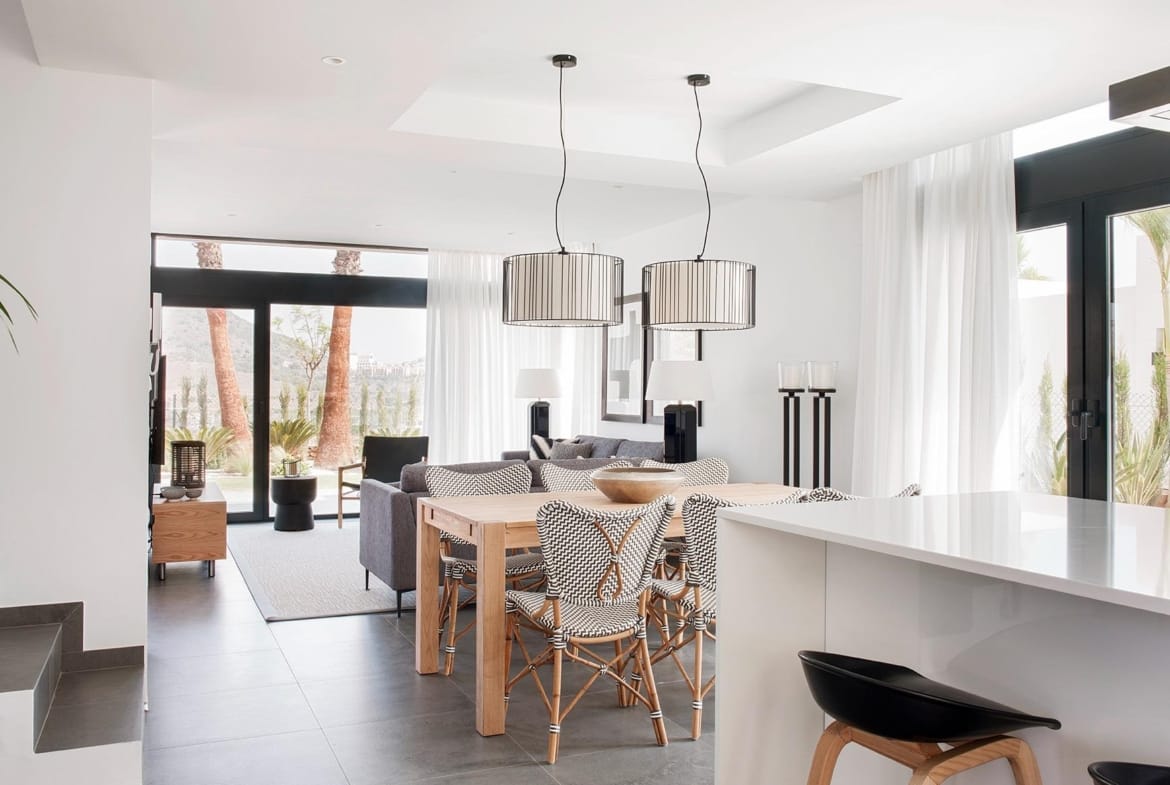 Open-plan kitchen, dining and living area with bright contemporary finishes in La Manga Club, Murcia