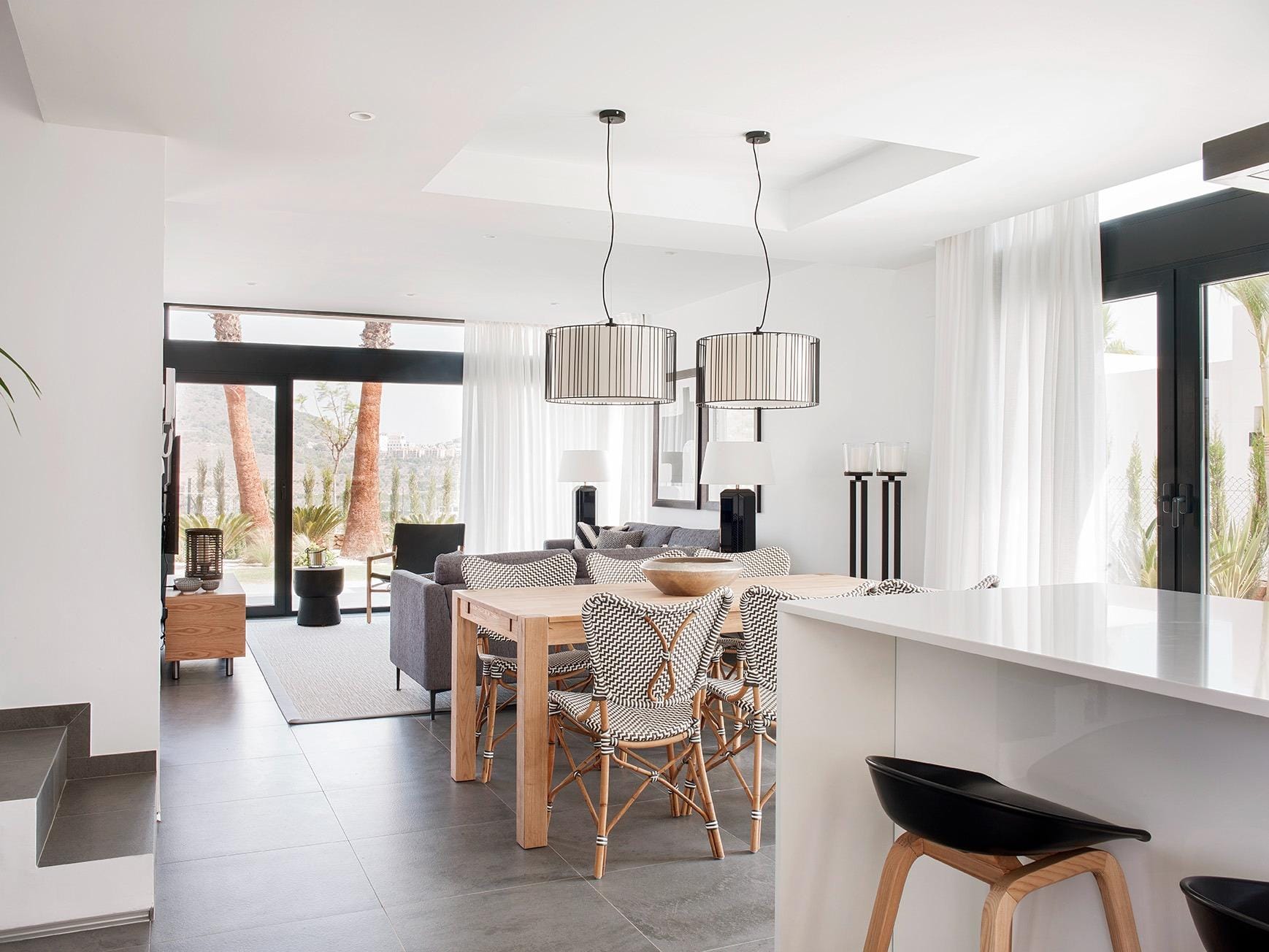 New-Build-Villas-for-Sale-at-La-Manga-Club-–-Luxury-Living-in-a-Prestigious-Resort-14 Open-plan kitchen, dining and living area with bright contemporary finishes in La Manga Club, Murcia