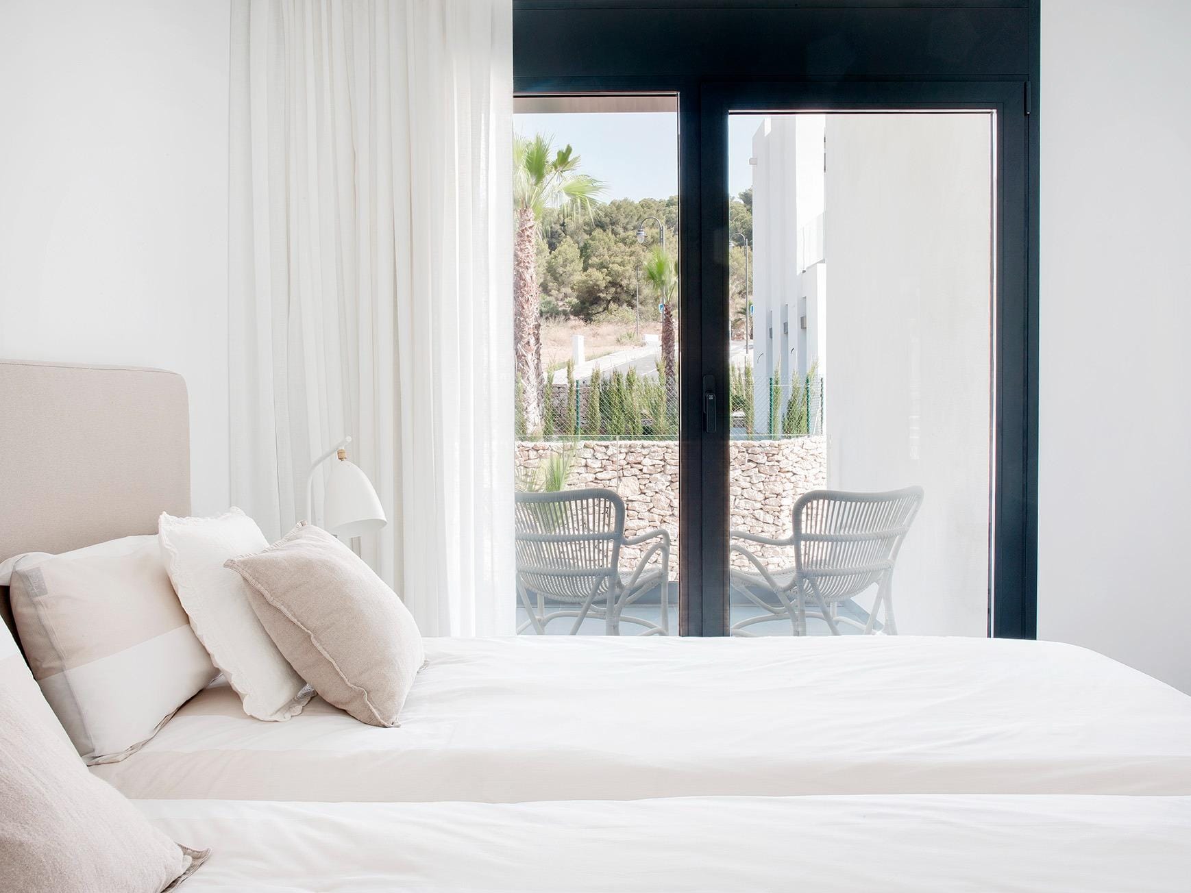 New-Build-Villas-for-Sale-at-La-Manga-Club-–-Luxury-Living-in-a-Prestigious-Resort-19 Twin bedroom opening onto a sheltered terrace in La Manga Club, Murcia