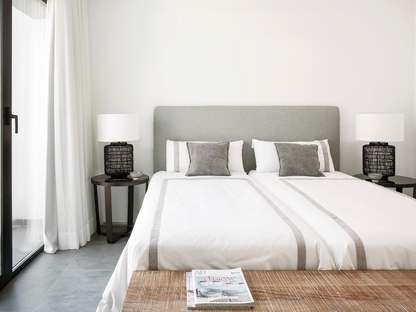 New-Build-Villas-for-Sale-at-La-Manga-Club-–-Luxury-Living-in-a-Prestigious-Resort-21 Twin bedroom with upholstered headboard and calm neutral styling in La Manga Club, Murcia