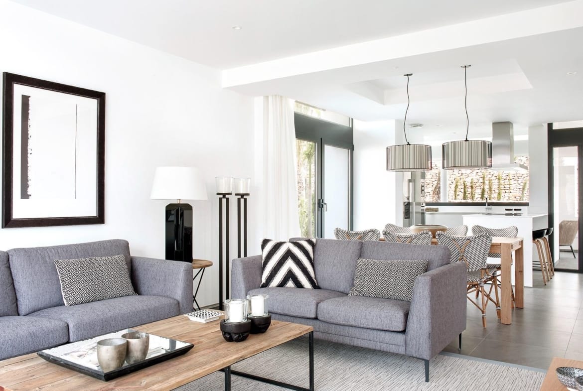 Open-plan lounge, dining space and sleek white kitchen in La Manga Club, Murcia