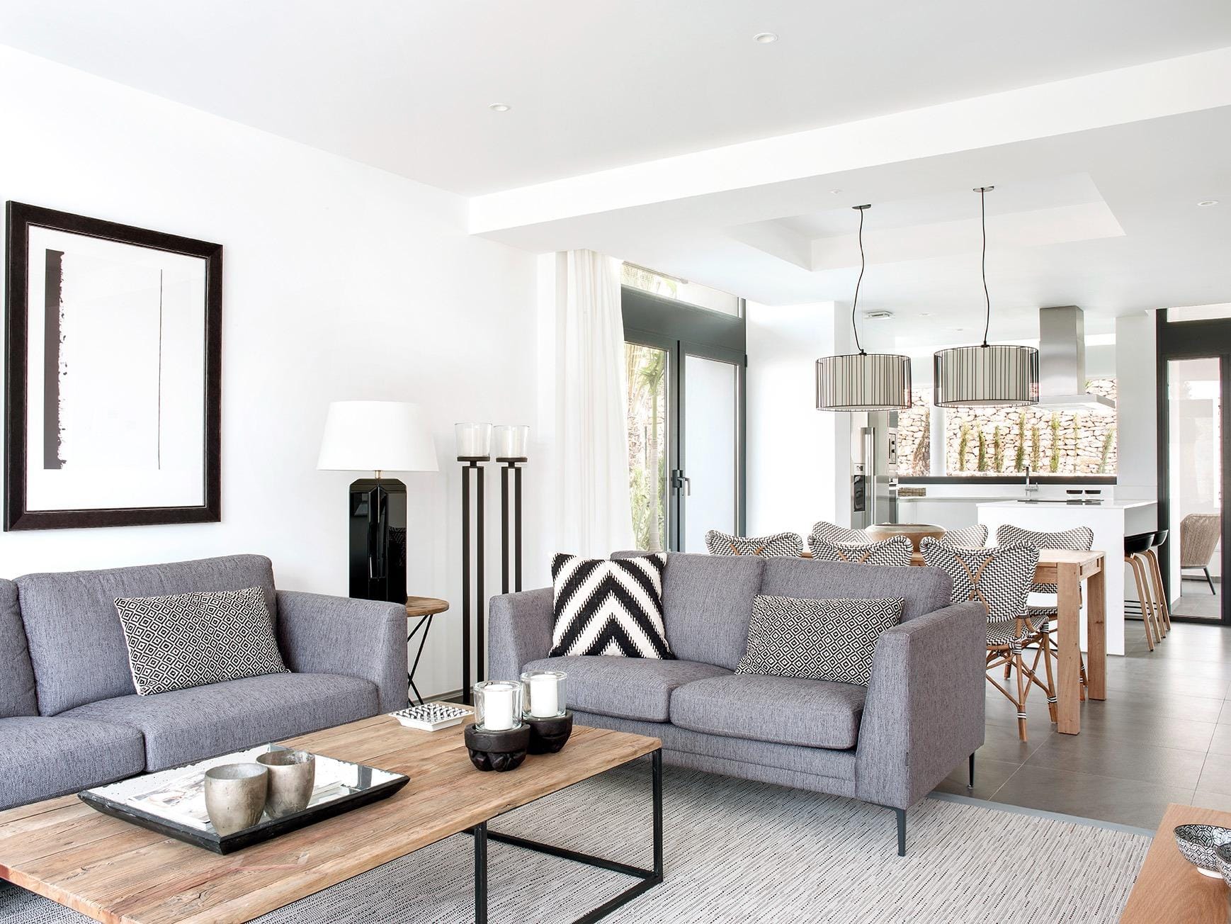 New-Build-Villas-for-Sale-at-La-Manga-Club-–-Luxury-Living-in-a-Prestigious-Resort-7 Open-plan lounge, dining space and sleek white kitchen in La Manga Club, Murcia
