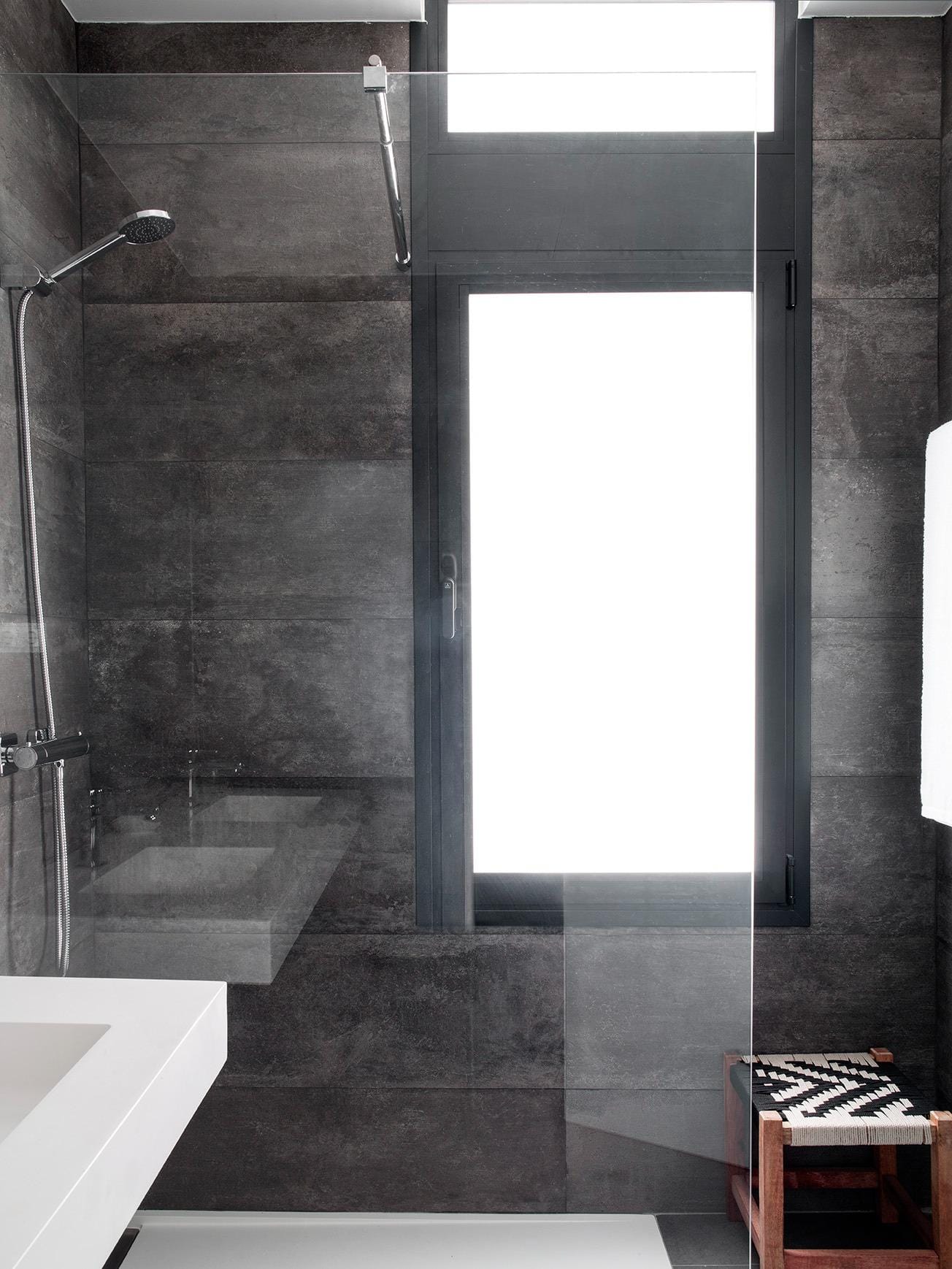 Walk-in shower with glass screen and tall frosted window in a villa in La Manga Club, Murcia