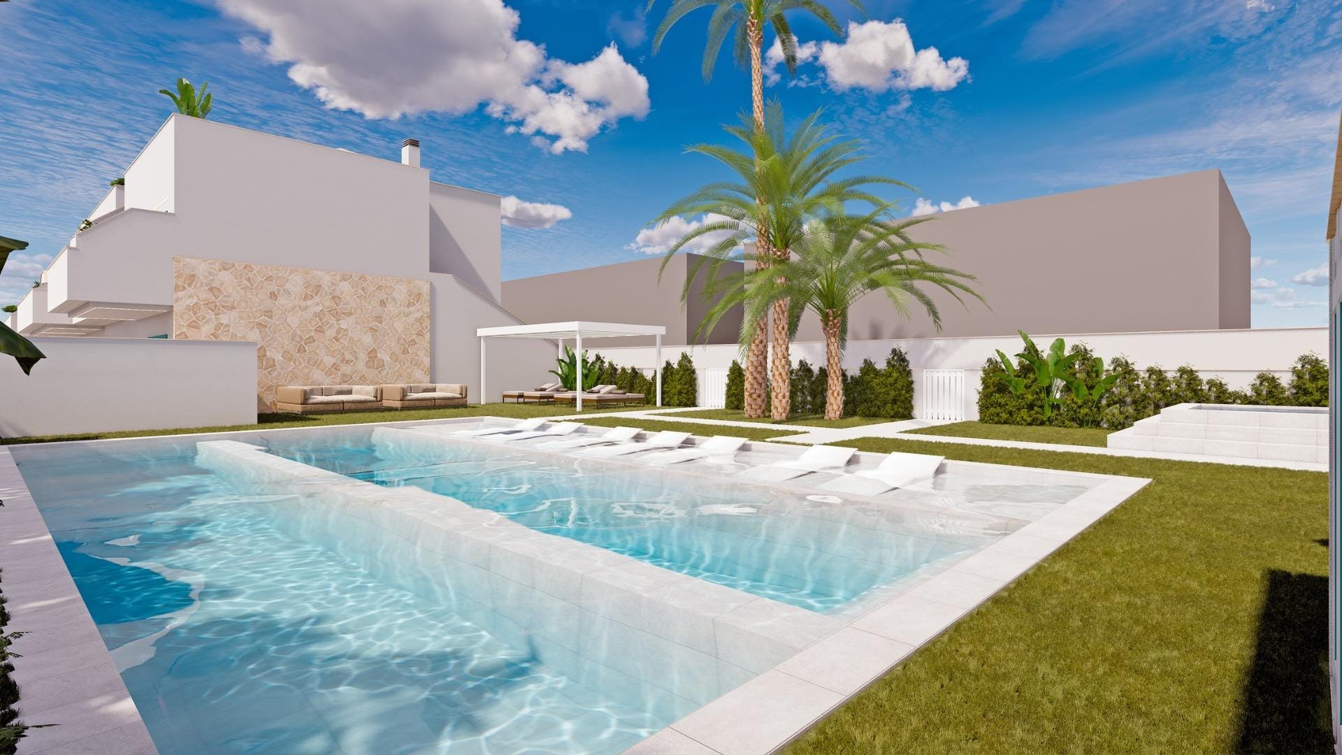 Swimming pool beside lawns, palms and white residential buildings in Torre de la Horadada, Alicante