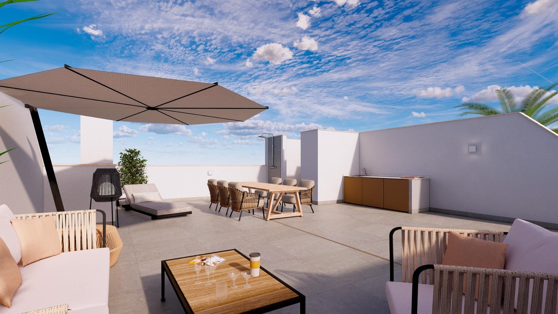 Rooftop terrace with an outdoor kitchen, dining table and shaded seating in Torre de la Horadada, Alicante