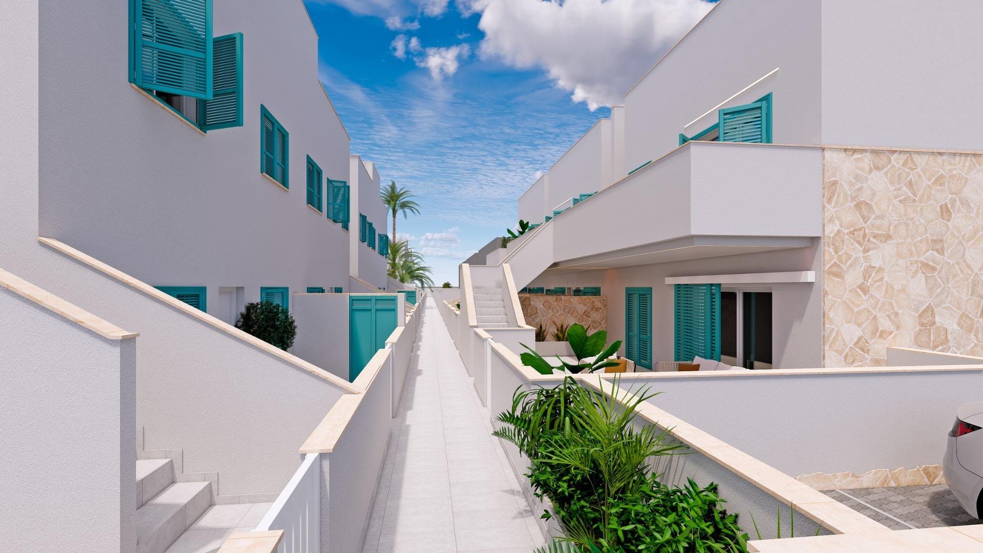 Walkway between white homes with turquoise shutters and terraces in Torre de la Horadada, Alicante