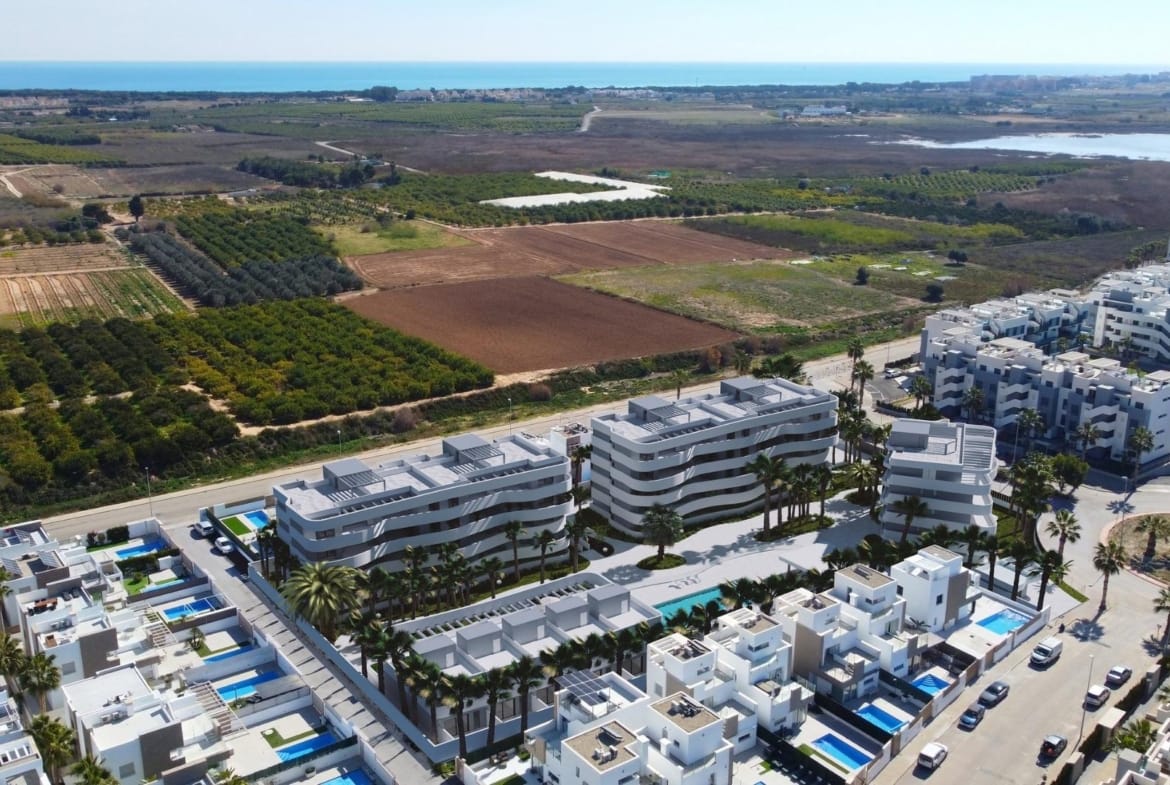 Aerial view of the development area beside farmland and open landscape in El Raso, Guardamar del Segura, Alicante