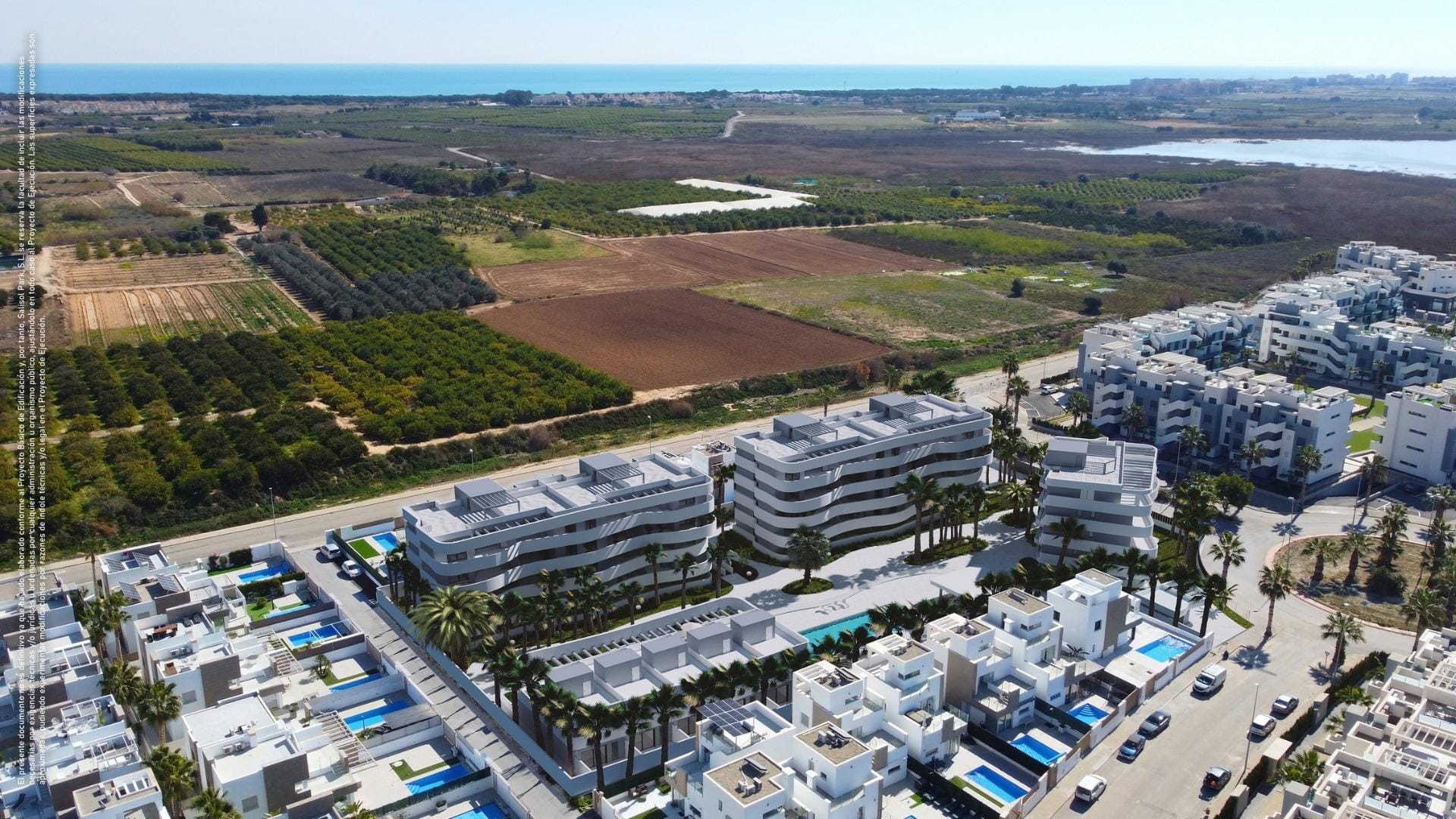Aerial view of the residential area with La Mata lagoon in the background in El Raso, Guardamar del Segura, Alicante