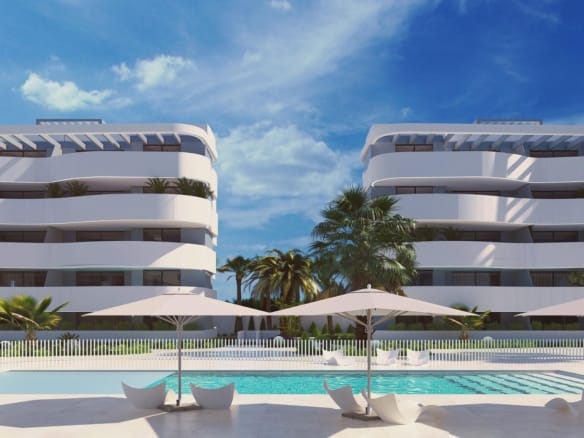 Evening rendering of an illuminated communal pool beside curved white apartment buildings in El Raso, Guardamar del Segura, Alicante