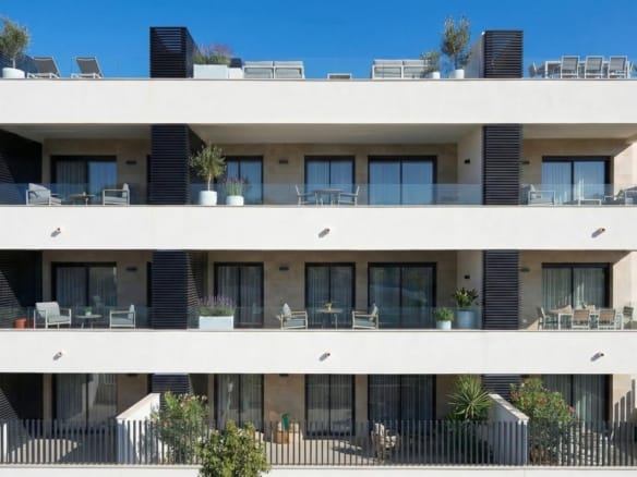 Architectural rendering of a white apartment building with broad terraces and dark privacy screens in Benijófar, Alicante