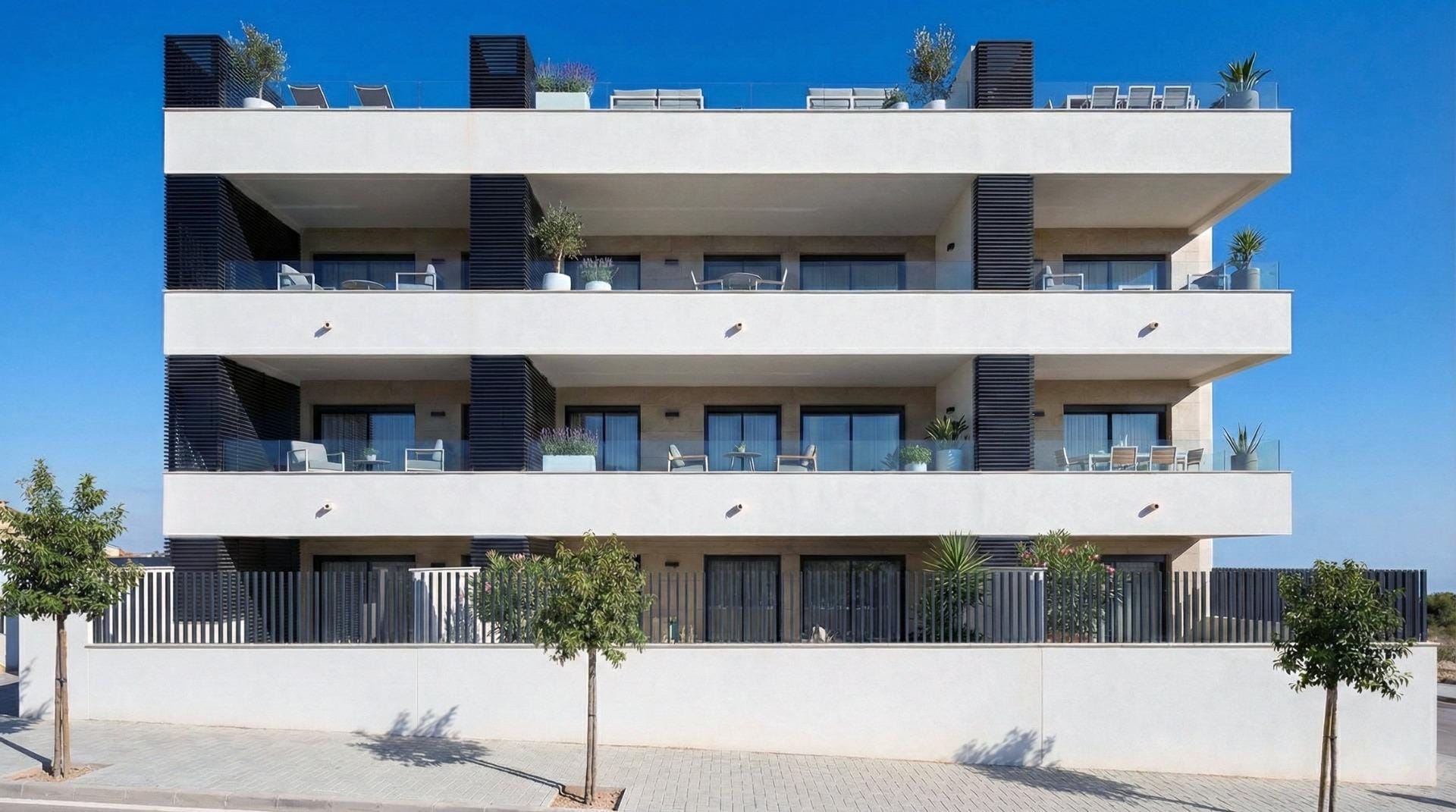 Architectural rendering of a white apartment building with broad terraces and dark privacy screens in Benijófar, Alicante