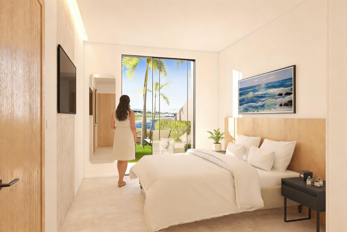 Double bedroom opening to the garden beside the golf course at Condado de Alhama Golf Resort