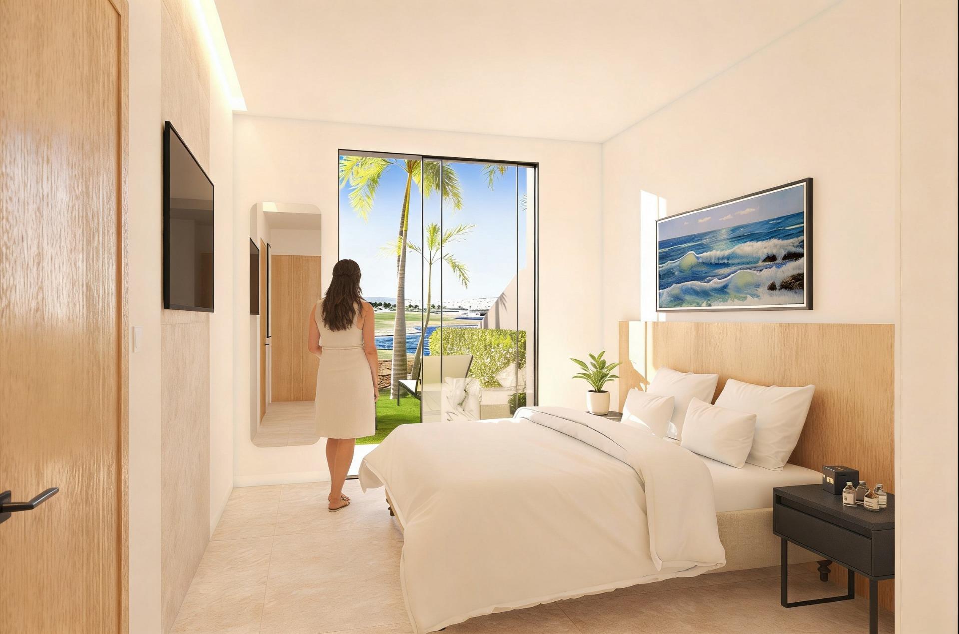 Double bedroom opening to the garden beside the golf course at Condado de Alhama Golf Resort
