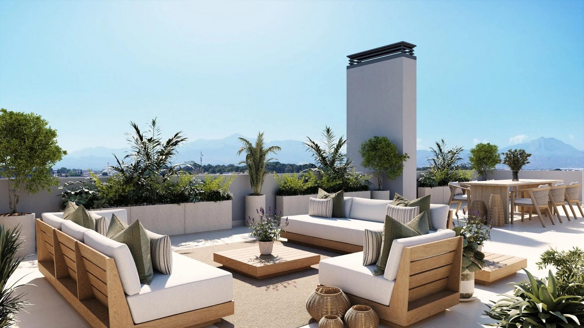 Newly built residential development in Alicante Rooftop terrace with outdoor sofas, dining furniture and mountain backdrop in San Agustín, Alicante