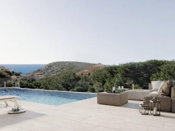 Pool terrace rendering with outdoor seating and sea views beyond wooded hills in Cumbre del Sol, Benitachell, Alicante