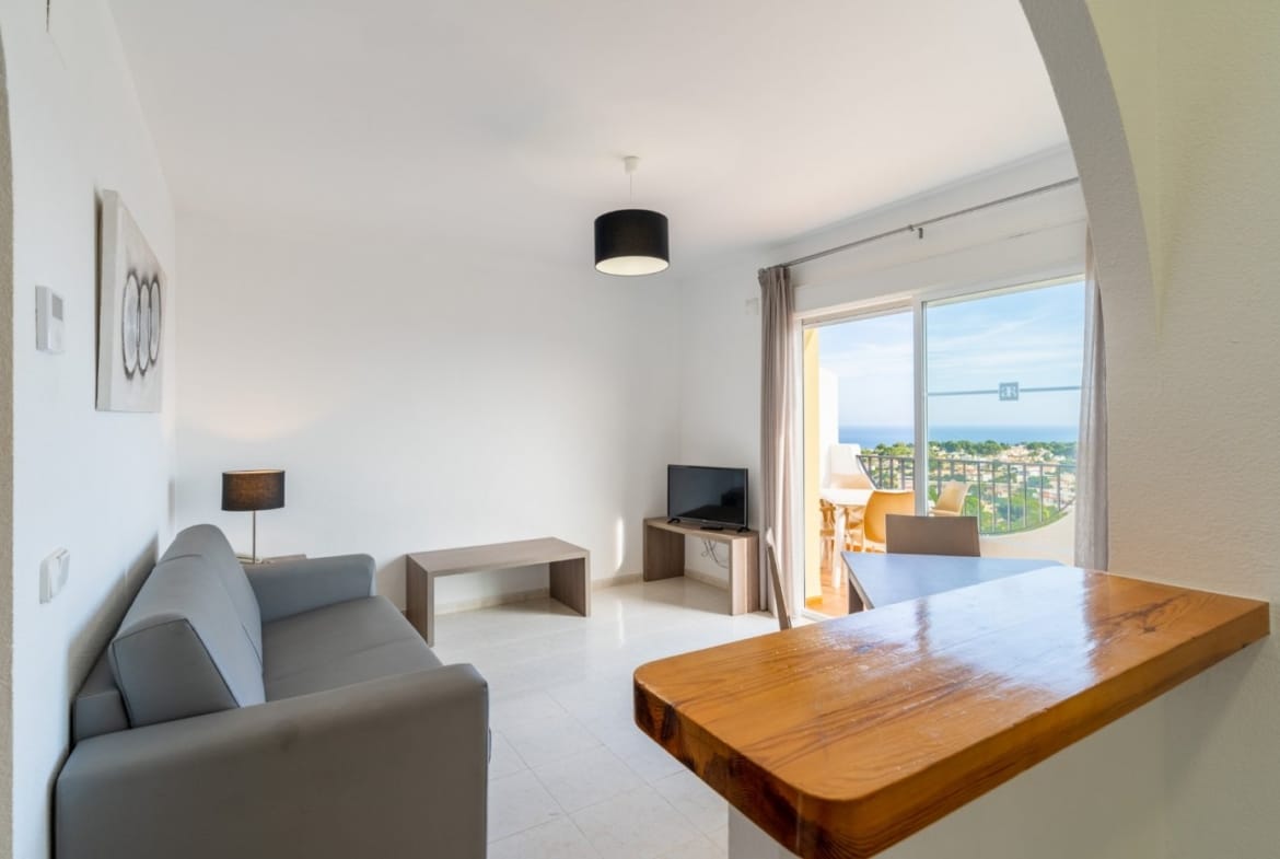 Open living room and kitchen breakfast bar facing a terrace with sea views in Gran Sol, Calpe, Alicante