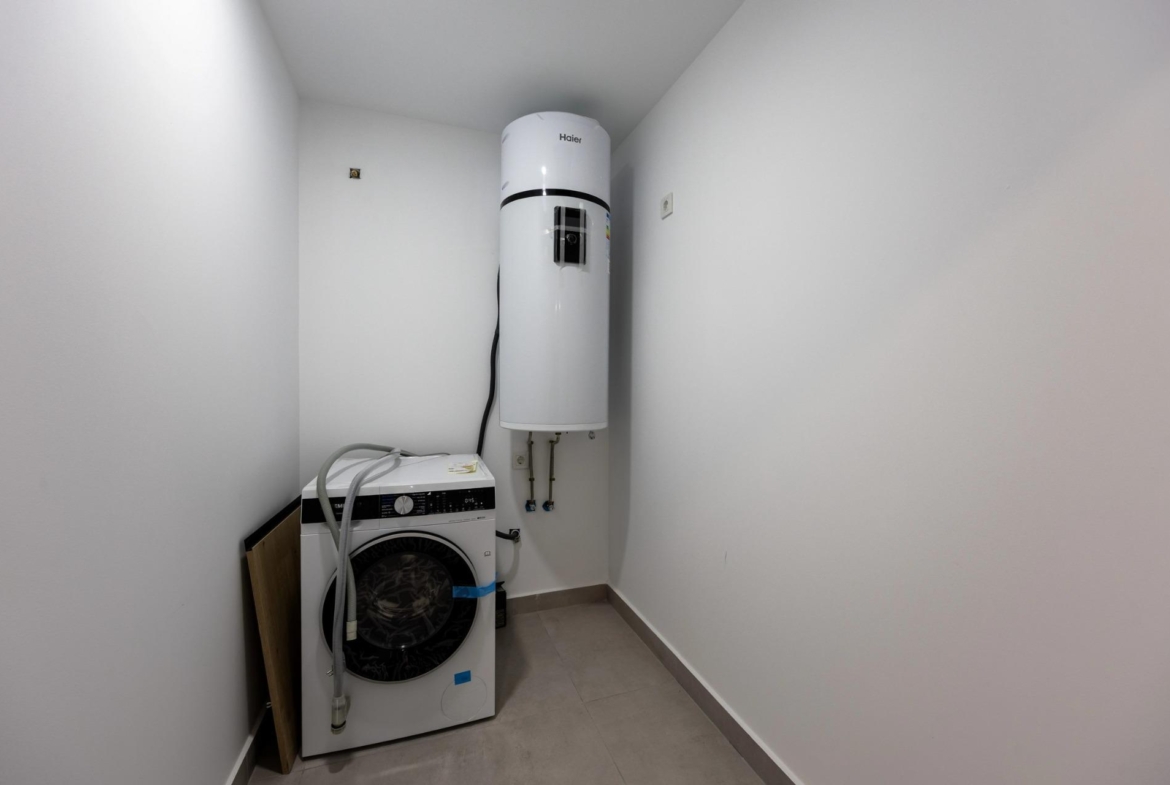 Unique-Investment-Opportunity-in-Villajoyosa-Costa-Blanca-North-18 Laundry room with aerothermal water heater