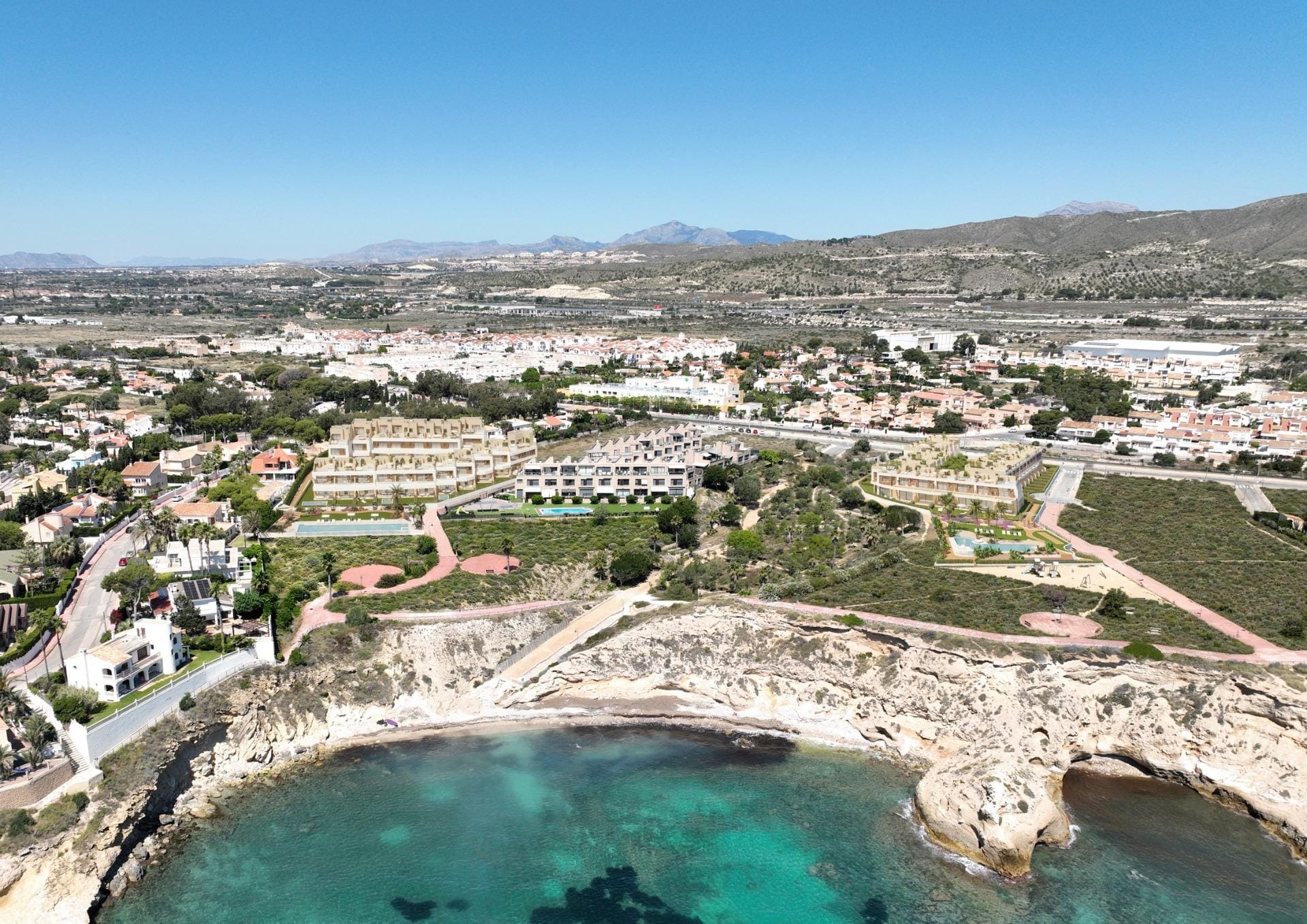 Exclusive-Frontline-Beach-Homes-in-El-Campello-Costa-Blanca-1 Aerial photograph of the coastline and development site in Playa del Amerador, El Campello, Alicante