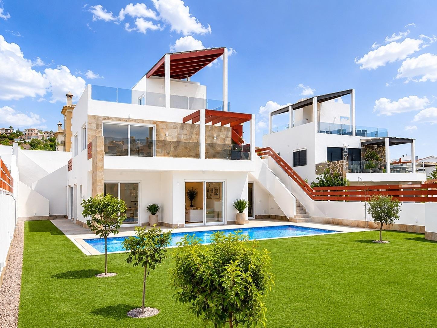 Villa and private swimming pool opening onto a lawn beside the golf course in La Marquesa, Ciudad Quesada, Alicante