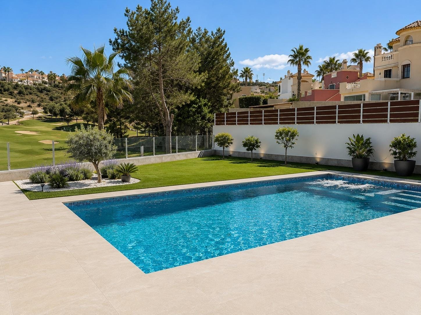Private swimming pool and lawn beside the golf course in La Marquesa, Ciudad Quesada, Alicante