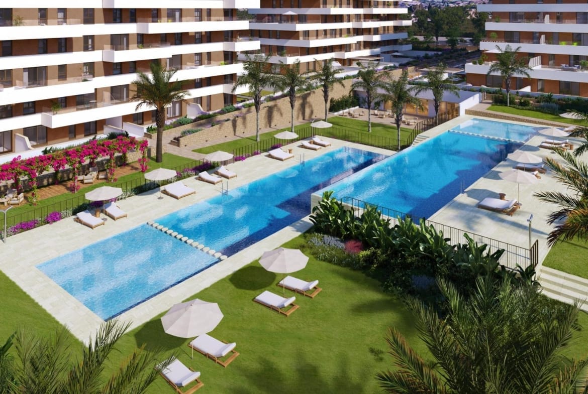 Communal pool and sun loungers beside the apartment buildings render in Playa del Torres, Villajoyosa, Alicante