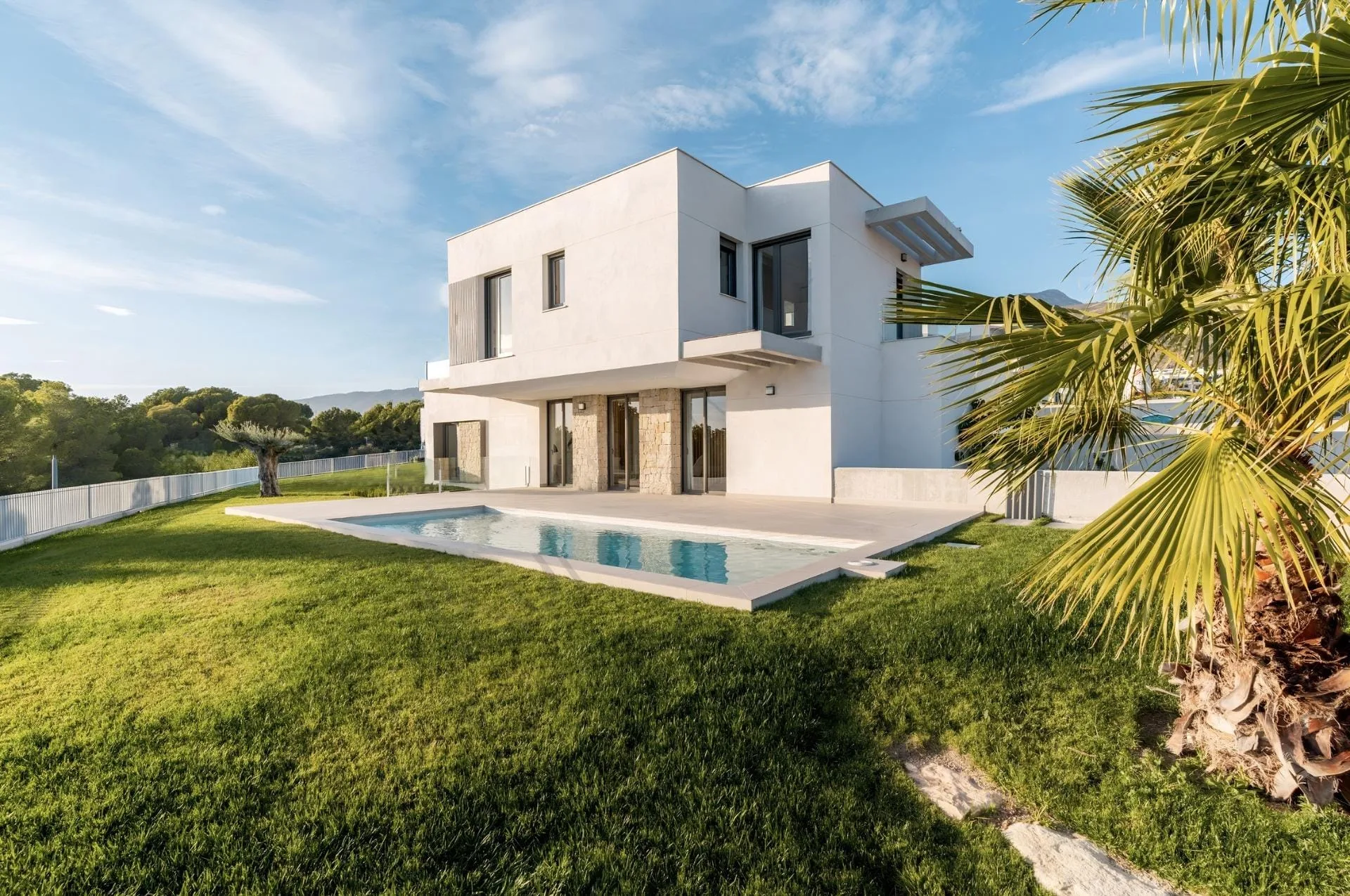 NEW BUILD VILLAS IN FINESTRAT Villa and private pool beside a lawn in Sierra Cortina, Finestrat, Alicante
