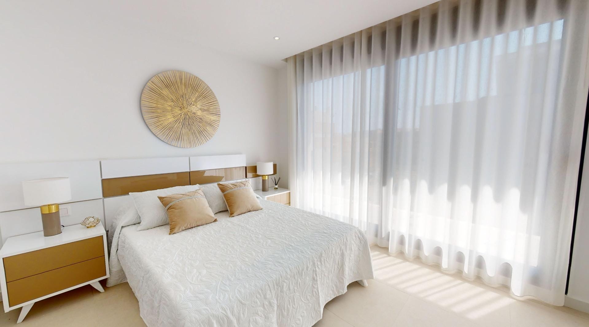 Example bedroom with a double bed and full-height curtains in La Marina, San Fulgencio, Alicante