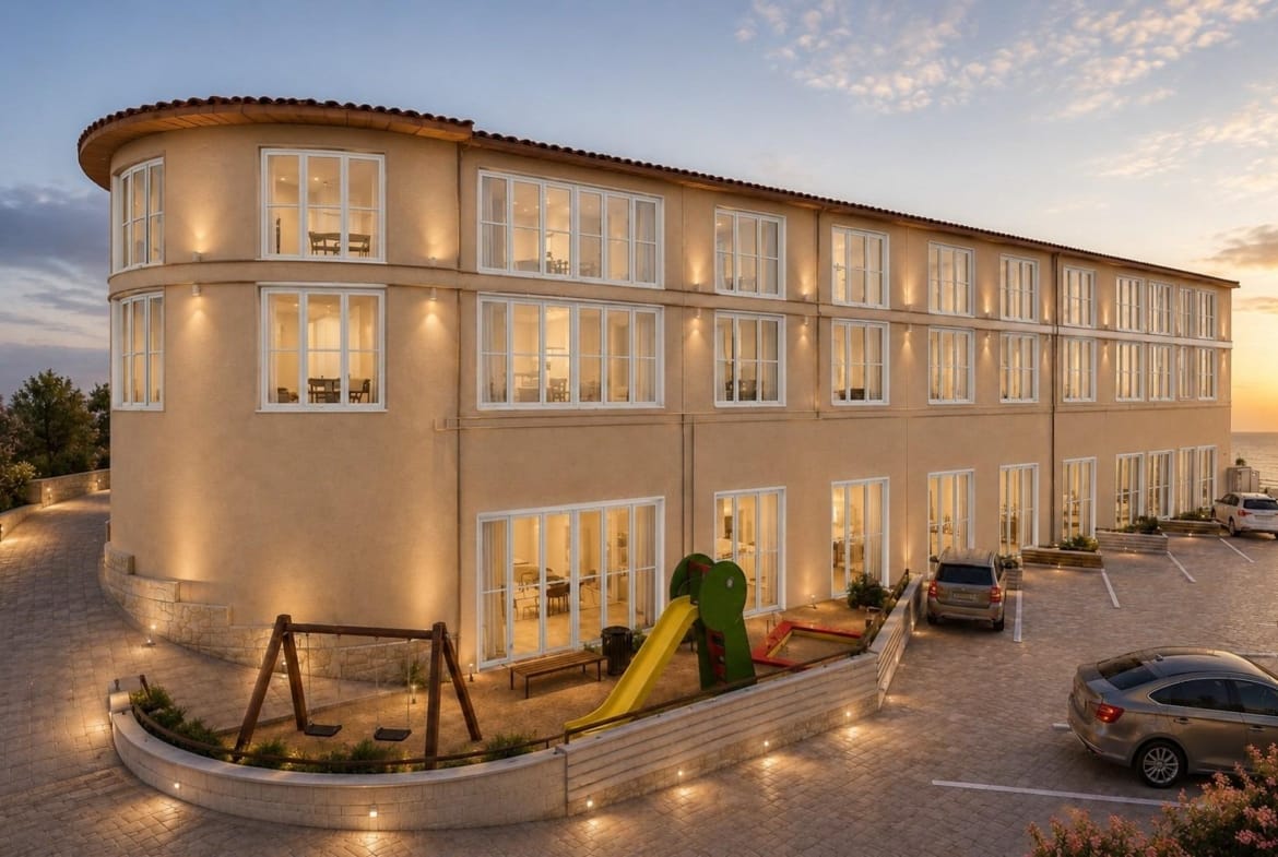 Rendering of the renovated apartment building with a small communal play area in El Muscaret, Relleu, Alicante