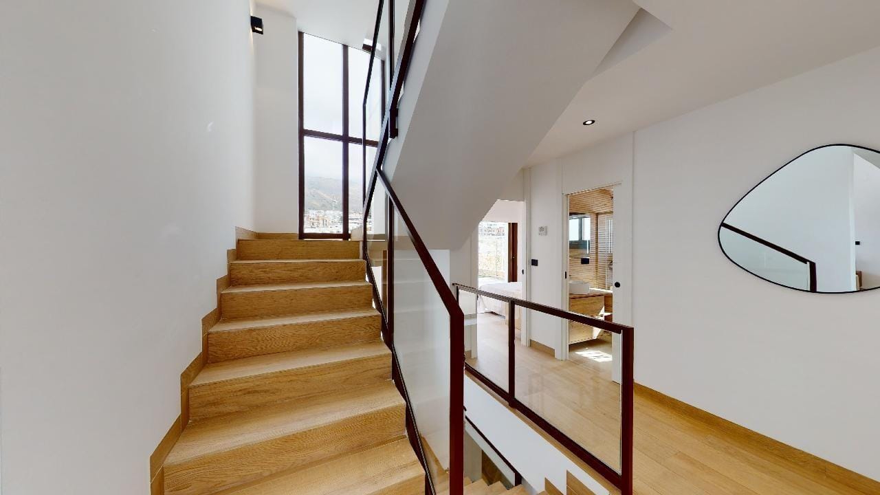 VILLAS-WITH-SEA-VIEWS-IN-FINESTRAT-3 Internal staircase with wood treads and dark balustrade in Campana Garden, Finestrat, Alicante