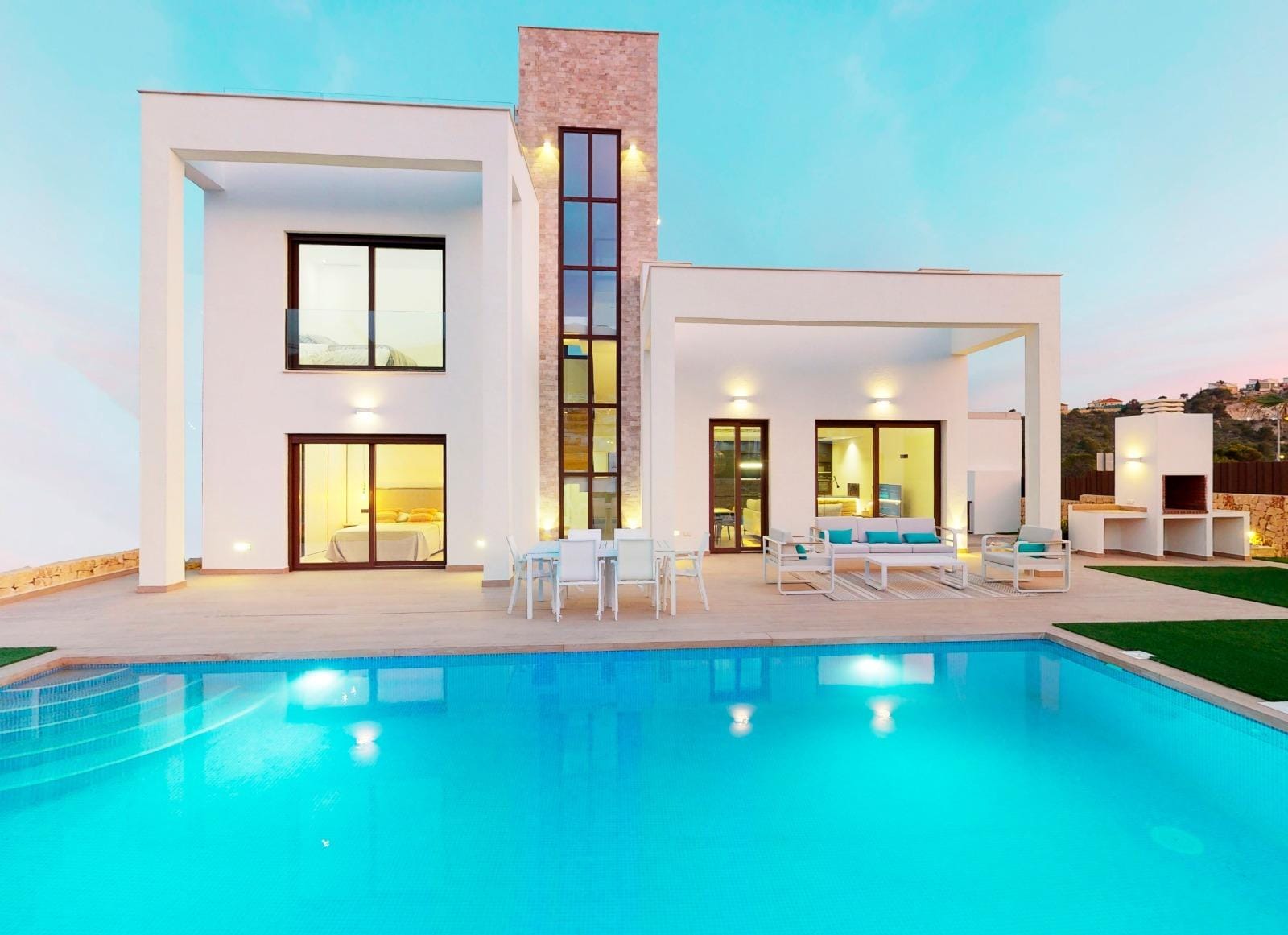 VILLAS WITH SEA VIEWS IN FINESTRAT !!! Villa and illuminated private pool at dusk in Campana Garden, Finestrat, Alicante