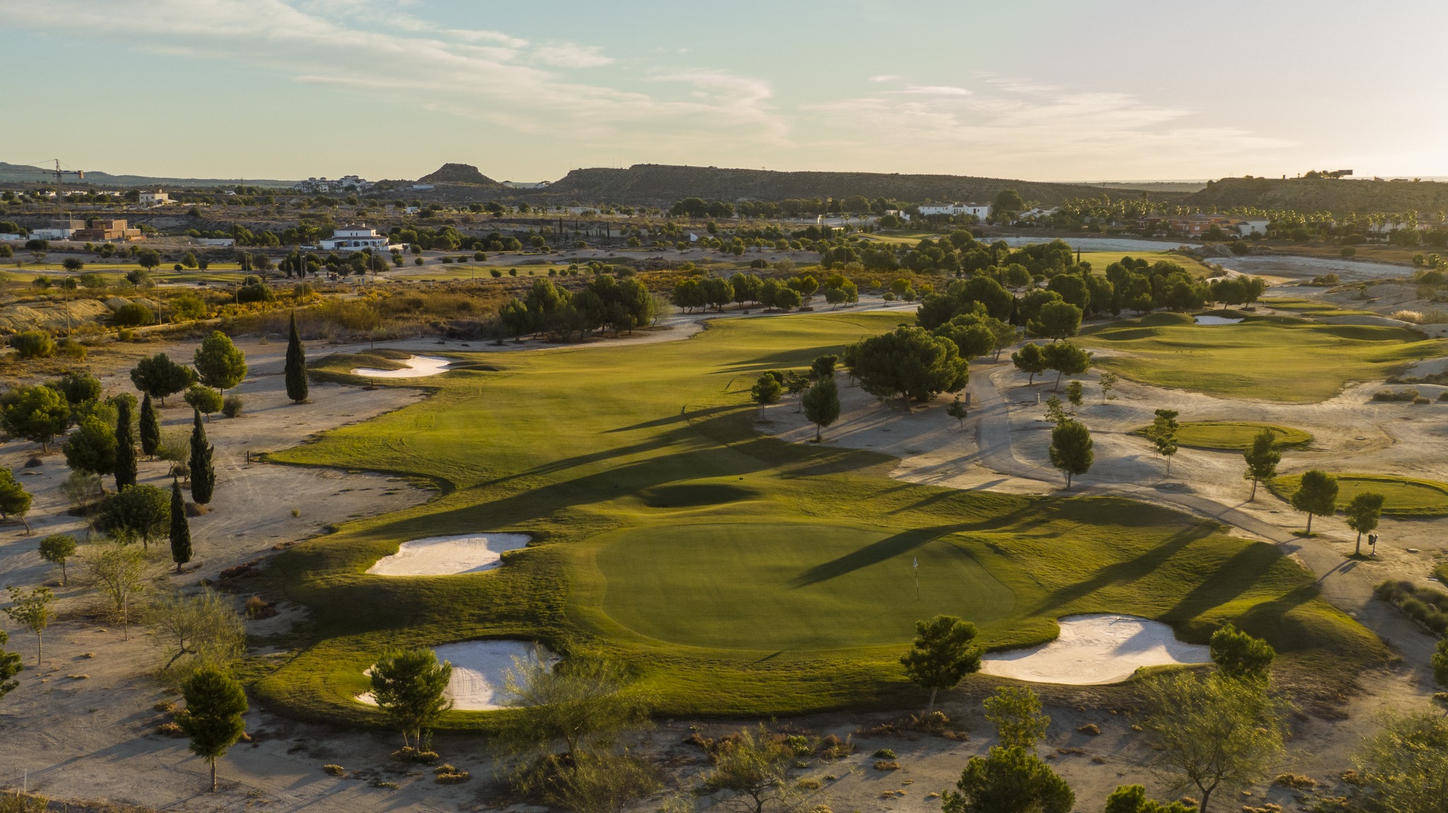Fairways, pine trees and surrounding hills at Altaona Golf, Murcia