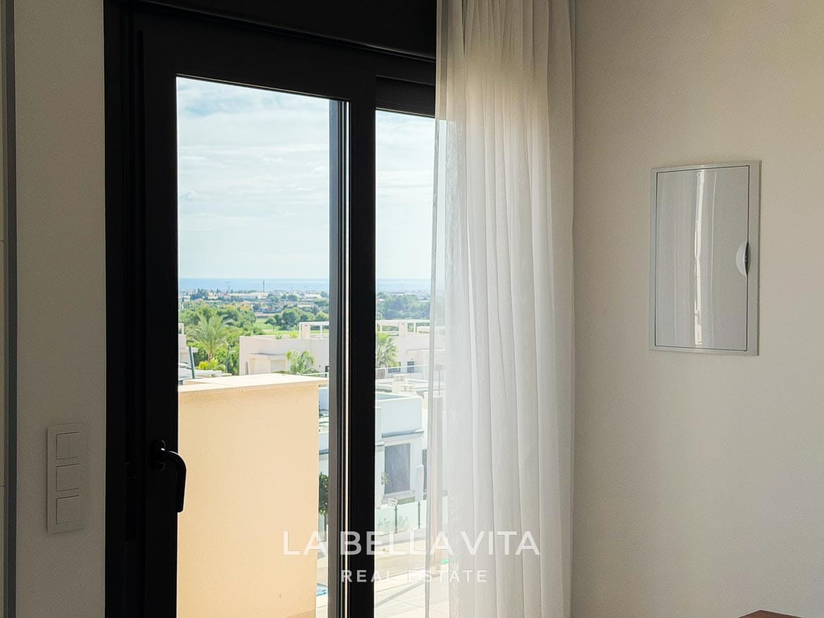 Modern Resale Apartment fot sale in Lo Romero Golf, Pilar de la Horadada, Alicante-18 Distant sea view through the glazed door beside the dining area