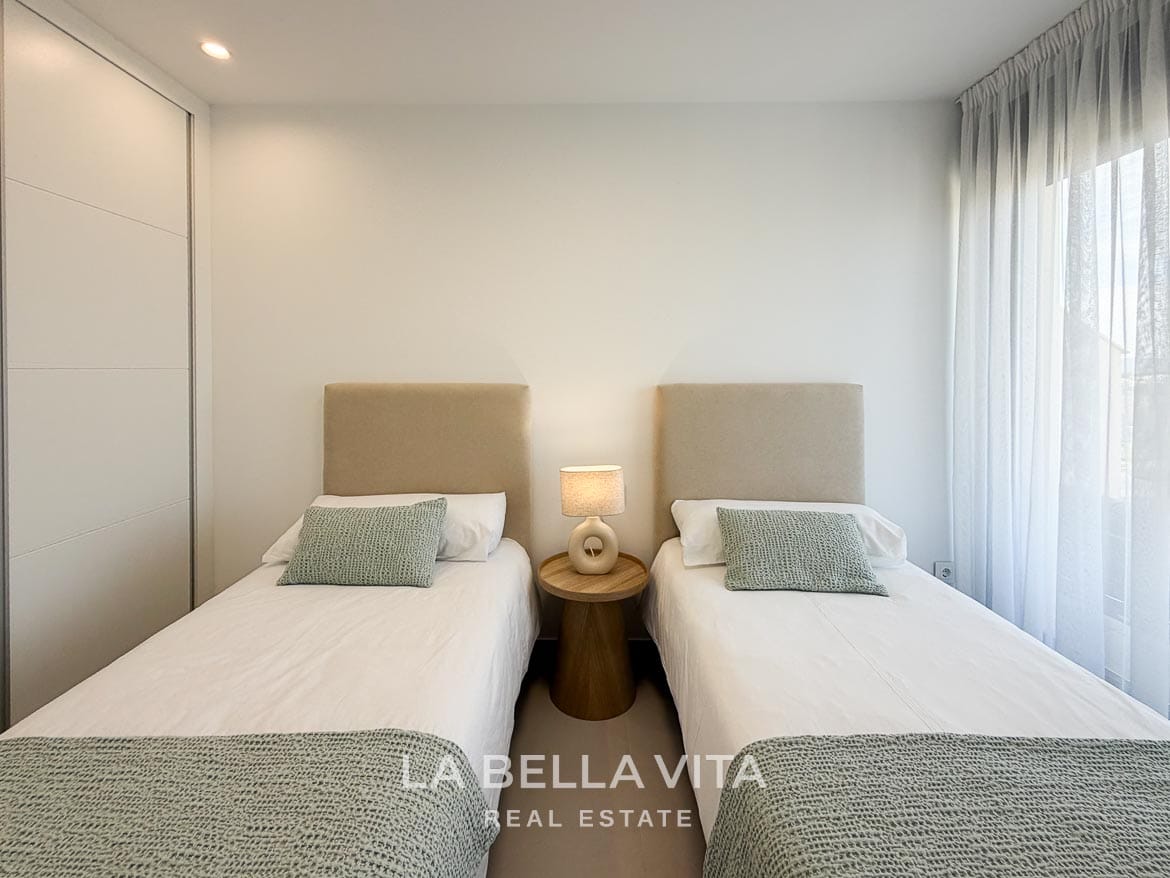 Modern Resale Apartment fot sale in Lo Romero Golf, Pilar de la Horadada, Alicante-28 Matching single beds with pale green throws and a shared bedside table