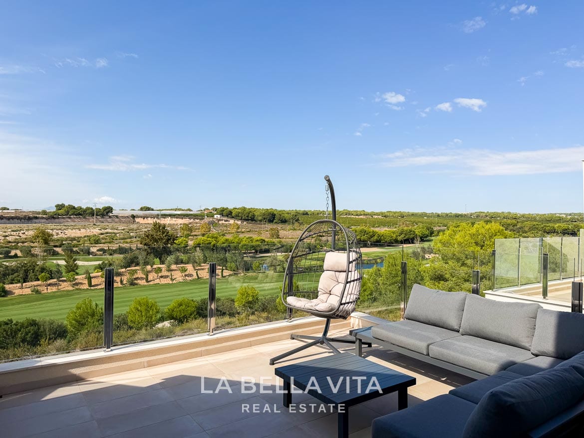 Modern Resale Apartment fot sale in Lo Romero Golf, Pilar de la Horadada, Alicante-30 Frontline golf terrace with an outdoor corner sofa, hanging chair and glass balustrade