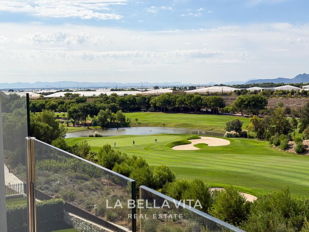 Modern Resale Apartment fot sale in Lo Romero Golf, Pilar de la Horadada, Alicante-32 View from the glass-fronted terrace across a golf green, sand bunker and lake