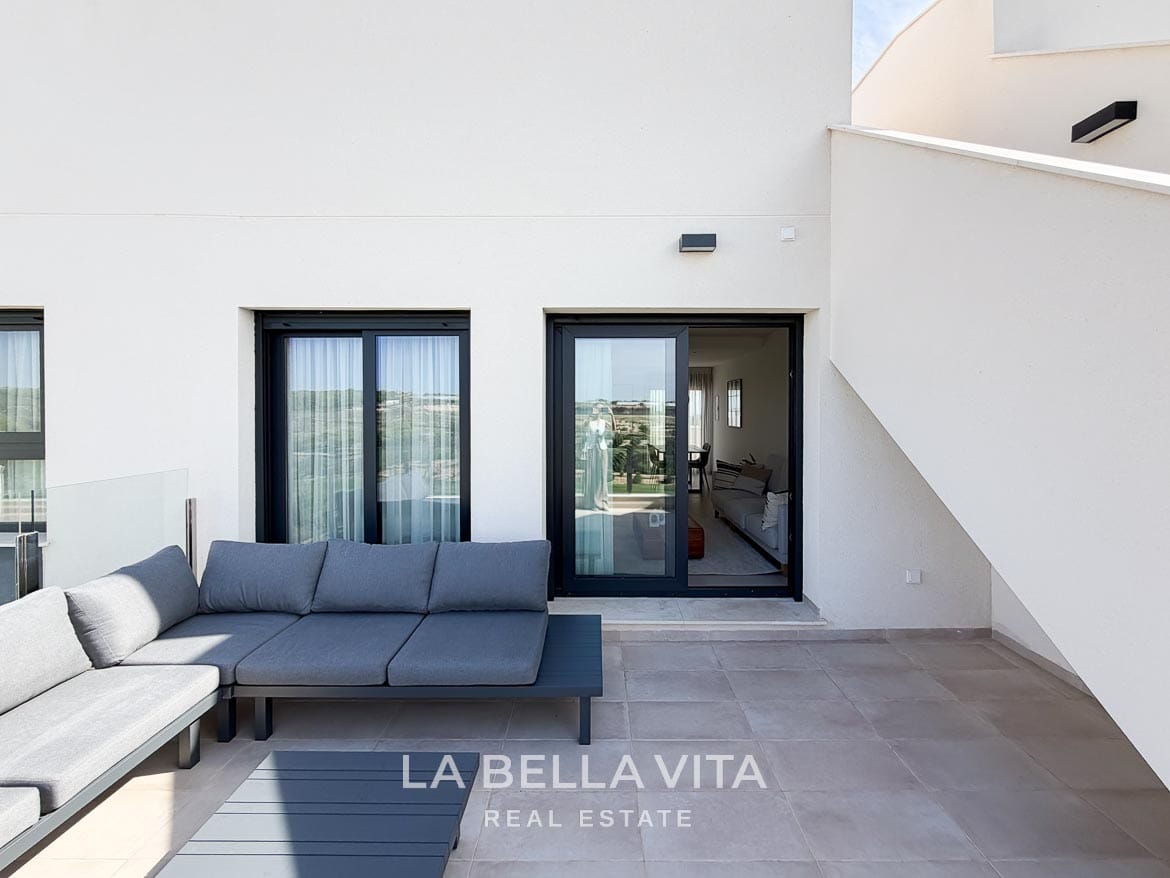 Modern Resale Apartment fot sale in Lo Romero Golf, Pilar de la Horadada, Alicante-33 Outdoor corner sofa on the tiled terrace beside the living room's sliding doors